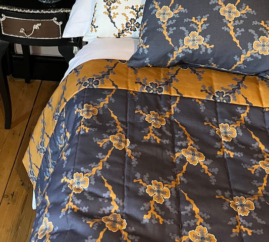 St James in Indigo/Ochre. Reversible channel quilted runner/throw for single bed or chair.