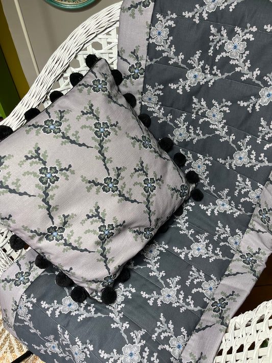 St James in Charcoal & Jet. Bundle of 2. Reversible cushion cover trimmed in black pom pots with quilted Throw/Runner