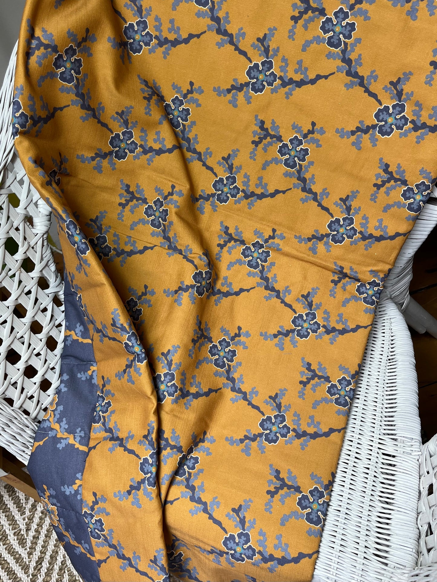 St James in Indigo/Ochre. Reversible channel quilted runner/throw for single bed or chair.