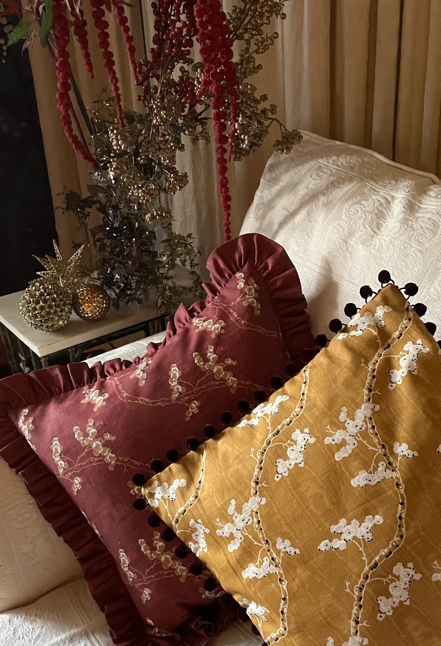 Dancing Alice in gold with Pressed Fern in ink on reverse. Small cushion cover in cotton trimmed with burgundy pompoms
