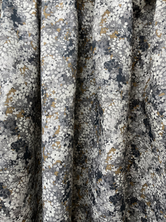 Joy Blossom in Charcoal/Bronze, printed on premium linen. A pretty carpet of lilac blossoms.