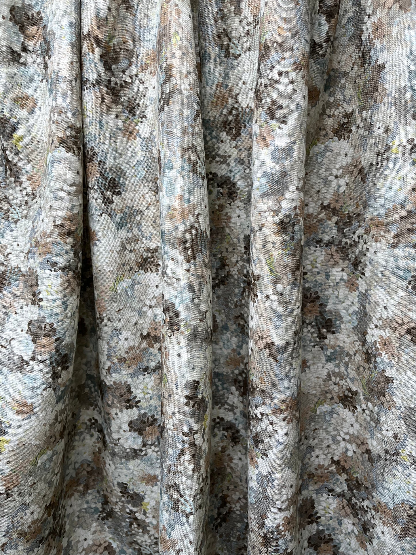 Joy Blossom in Silver Mushroom, printed on premium Irish linen. A pretty carpet of lilac blossoms.